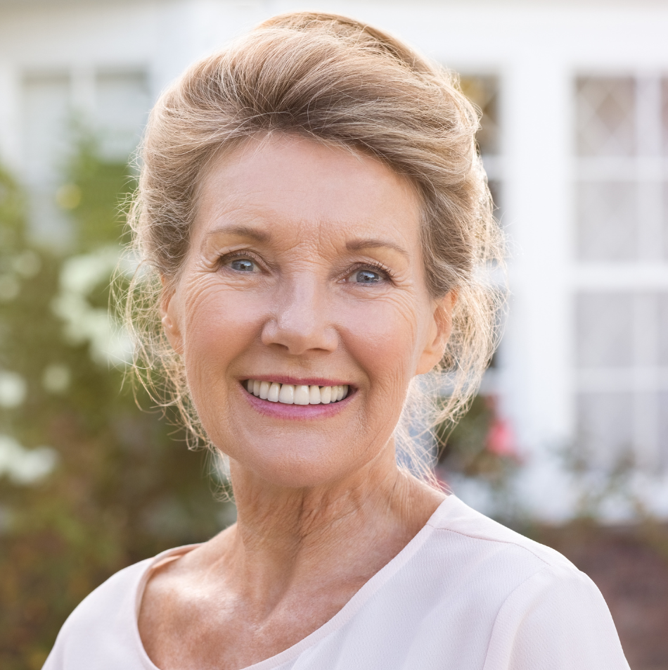 Patient shows results from affordable dental implants in Gilbert, AZ, restoring a confident, natural-looking smile.