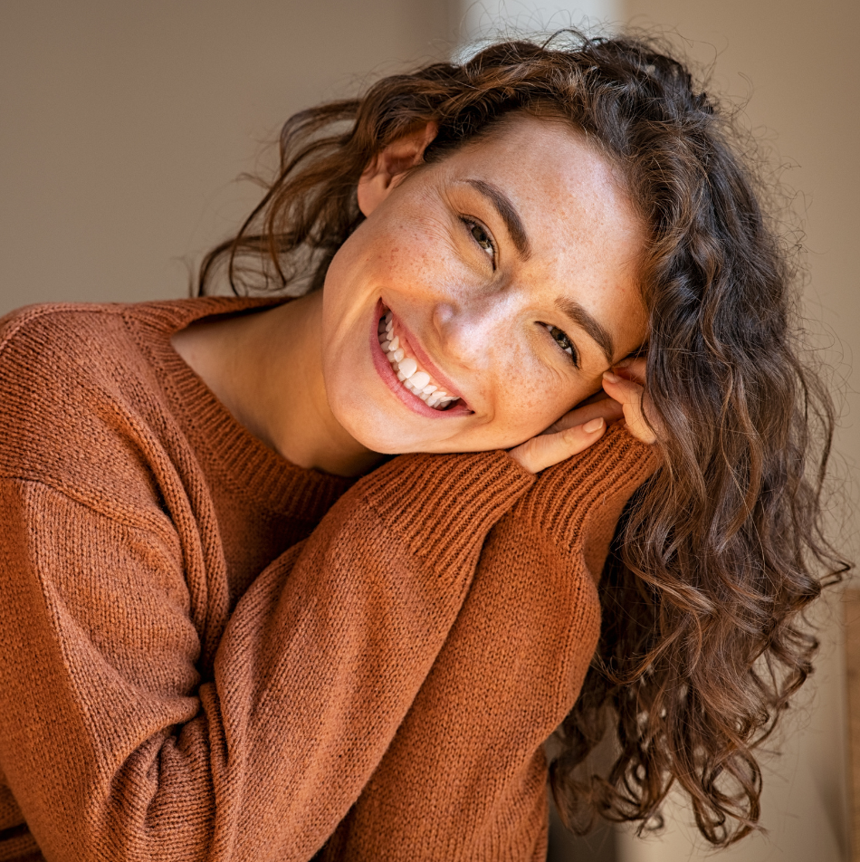 Patient shows results from gummy smile laser treatment in Gilbert, AZ for a balanced, confident smile.