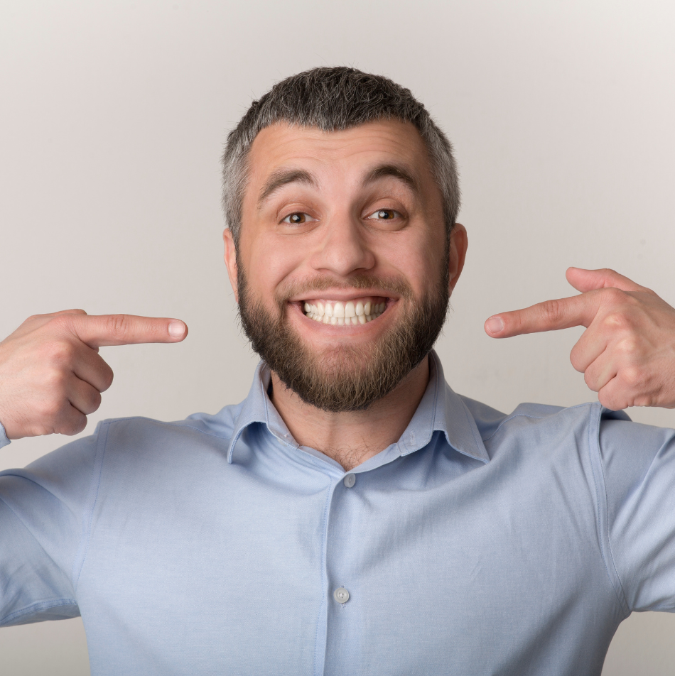 Patient enjoying the results of a full smile makeover in Gilbert, AZ, showcasing expert cosmetic dental care and same-day smile makeover treatments.