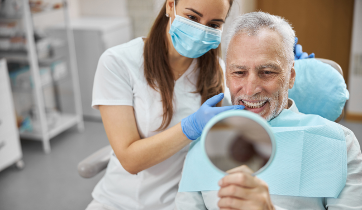 Dental implant dentist in Gilbert, AZ discussing treatment options and personalized care with a patient.